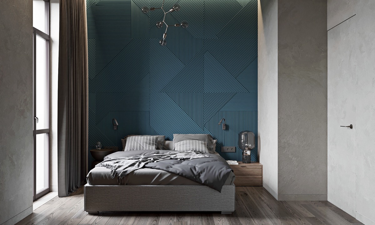 Trong phòng ngủ, ngôn ngữ thiết kế vẫn được phát huy với bức tường màu xanh và giường tông màu xám sáng. Mô hình hình học trên tường là điểm nhấn cho căn phòng.