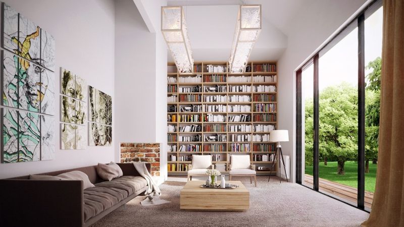  “Tháp sách” này mang lại độ sâu lớn, sự thú vị và cả sự ấm áp cho căn phòng dài với gam màu nhợt nhạt này. Nó tạo ra một bức tường đẹp với màu của bìa sách, của gỗ và cả giấ… cho mẫu nội thất phòng khách trên.